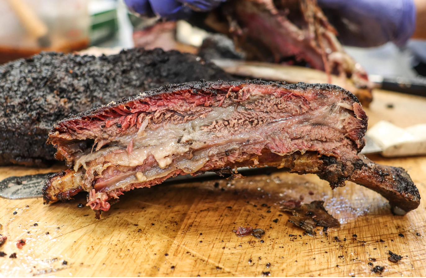 Berkshire pork ribs — deep bark and smoke ring, Avellino Family Barbecue